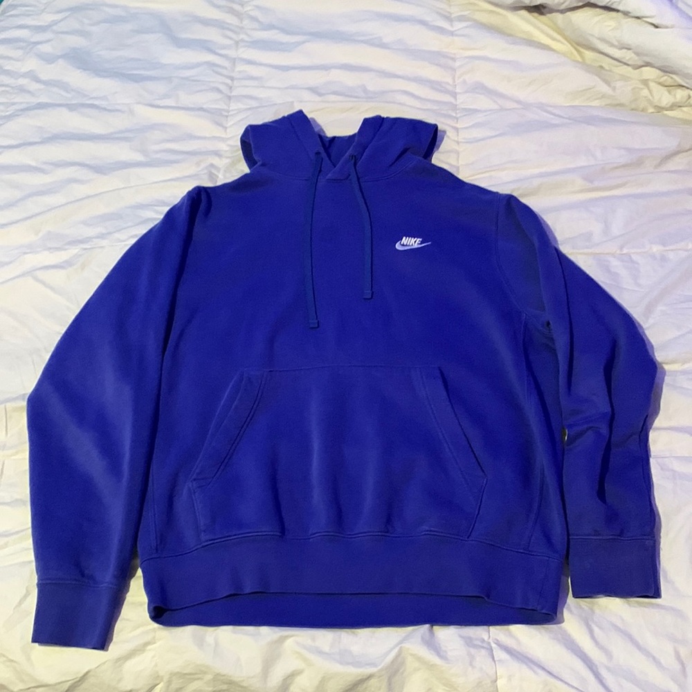 Light-ish blue NIKE hoodie. Its a size Medium, no stains, no de-coloration.